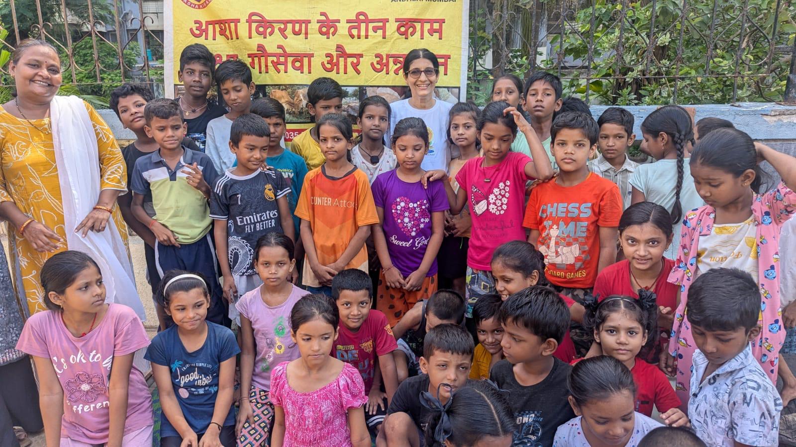Group photo with children after a community yoga session